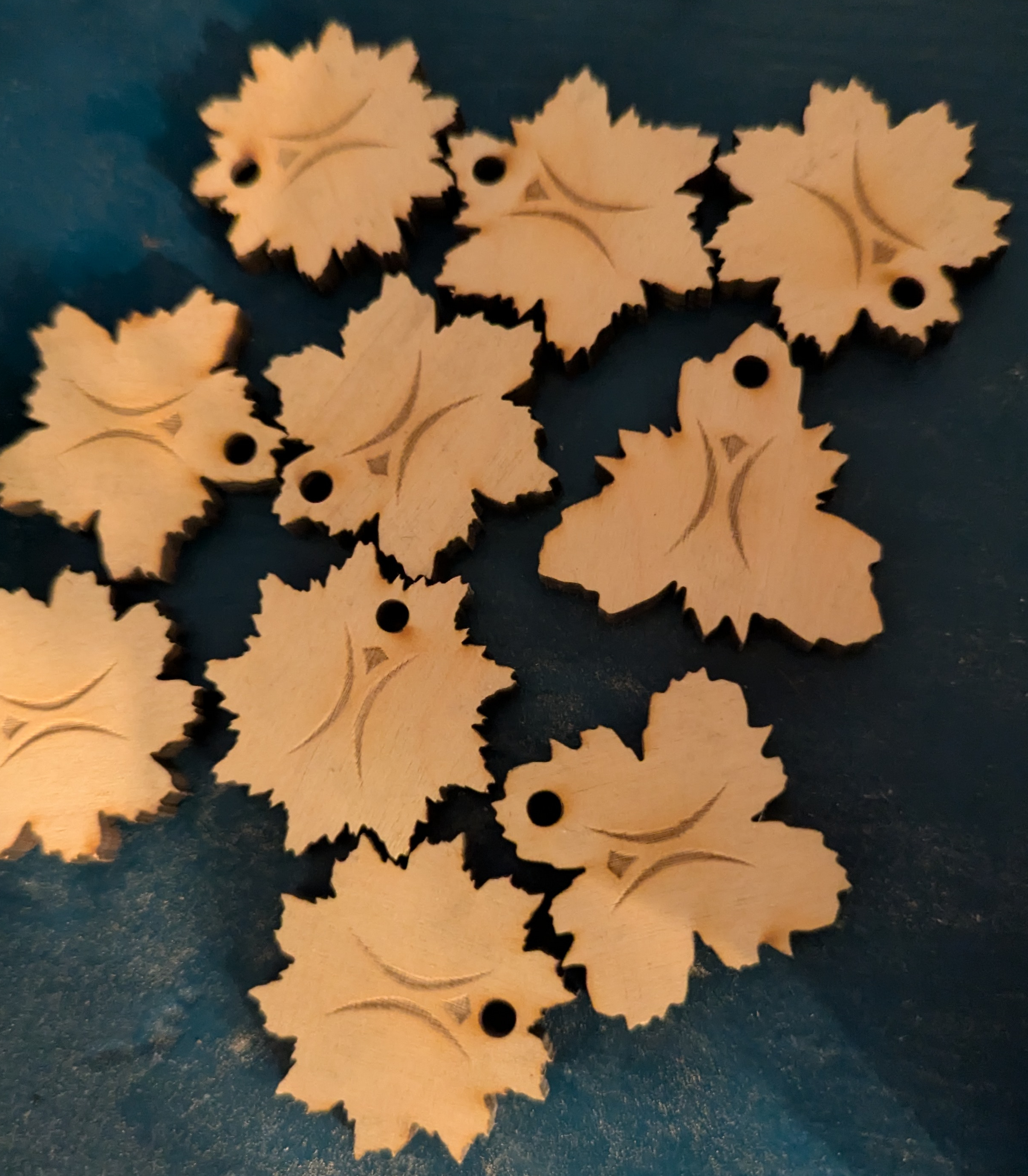 wooden pendants in a variety of symmetrical jagged shapes